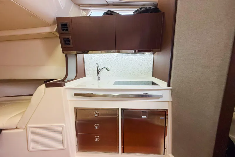  Yacht Photos Pics 2022 Grady-White Canyon 456 boat interior with modern kitchenette and storage.