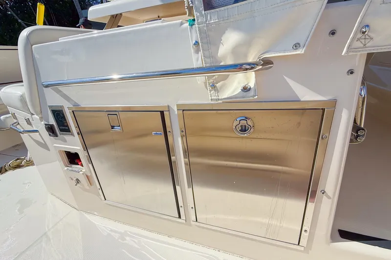  Yacht Photos Pics 2022 Grady-White Canyon 456 boat interior with stainless steel storage compartments.