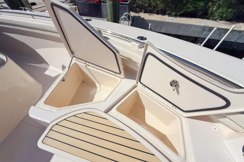  Yacht Photos Pics Open storage compartments on a 2022 Grady-White Canyon 456 boat deck.