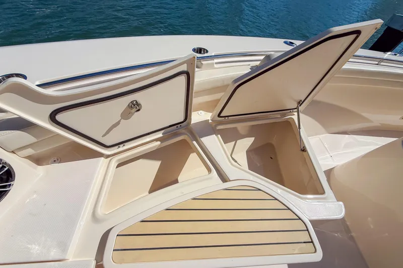  Yacht Photos Pics 2022 Grady-White Canyon 456 boat storage compartments open on deck.