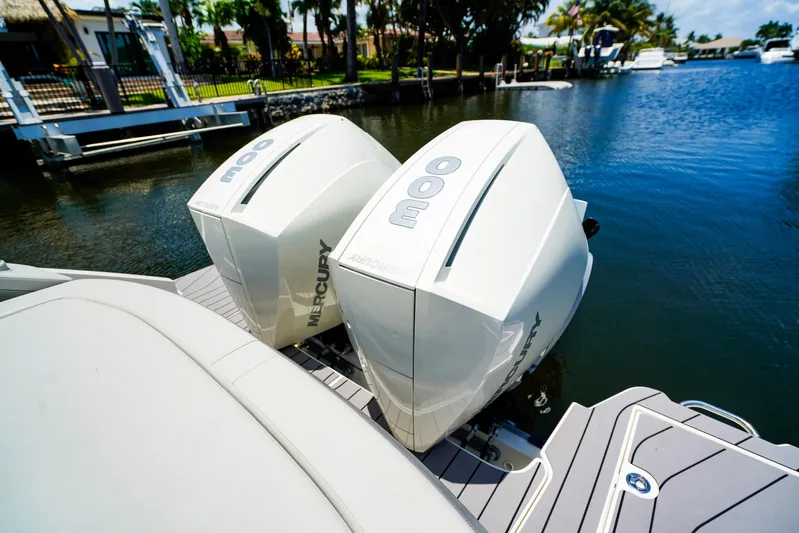  Yacht Photos Pics 2022 Sea Ray SLX 310 OB with twin Mercury outboard engines on a sunny day.