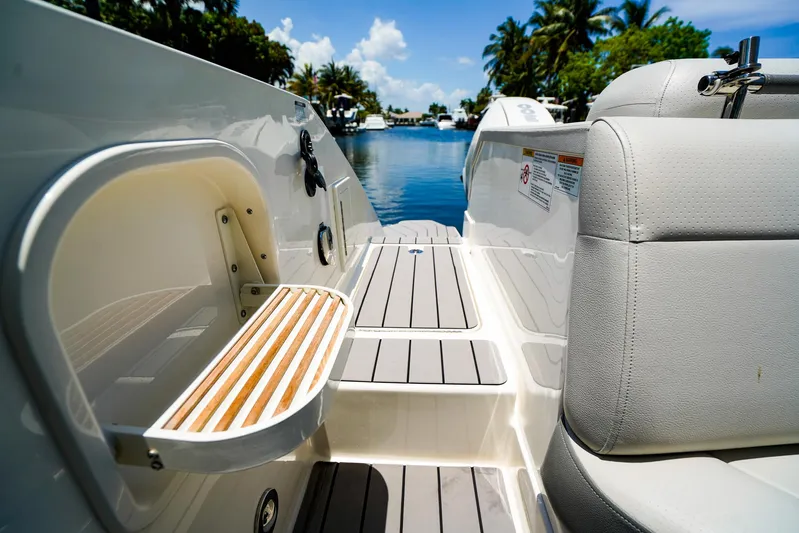  Yacht Photos Pics 2022 Sea Ray SLX 310 OB boat interior with seating and deck view.