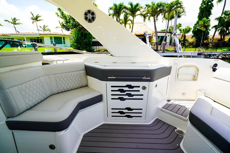  Yacht Photos Pics Luxurious interior of 2022 Sea Ray SLX 310 OB boat with elegant seating and modern design.