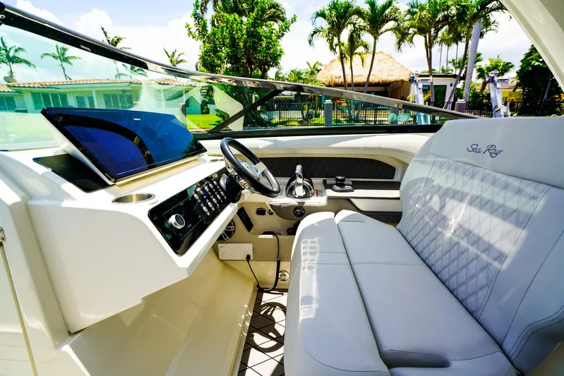  Yacht Photos Pics 2022 Sea Ray SLX 310 OB boat interior with luxurious seating and modern dashboard.