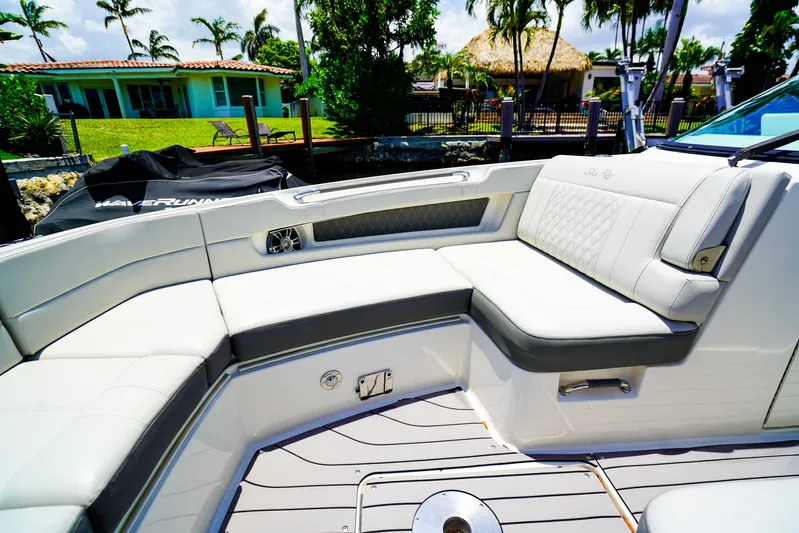  Yacht Photos Pics Luxurious seating on 2022 Sea Ray SLX 310 OB boat, featuring elegant design and comfort.