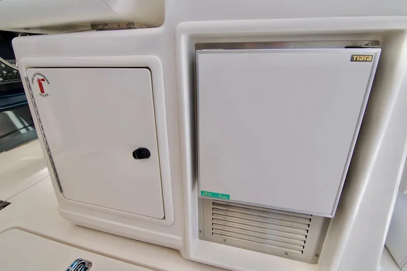 Revelry Yacht Photos Pics 2002 Tiara Yachts 3500 Open interior with storage and refrigerator compartments.