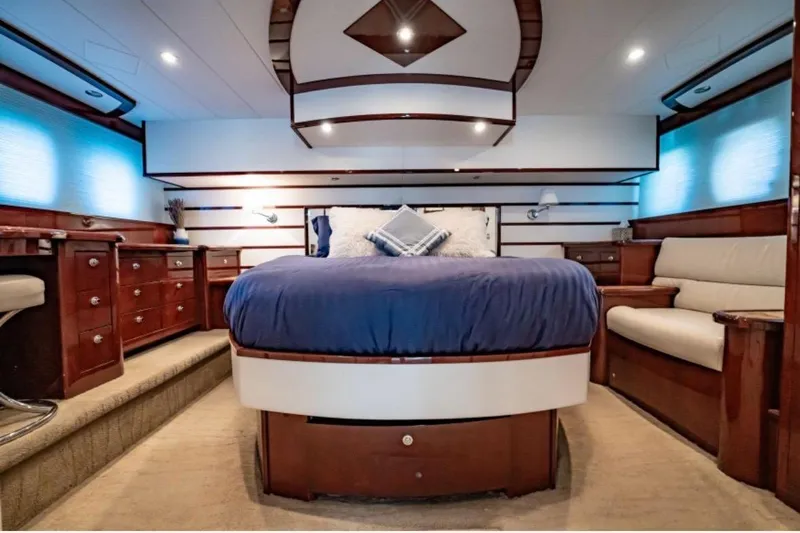 My Reality Yacht Photos Pics Luxurious 2012 Neptunus 62 Flybridge yacht bedroom with elegant wood furnishings.