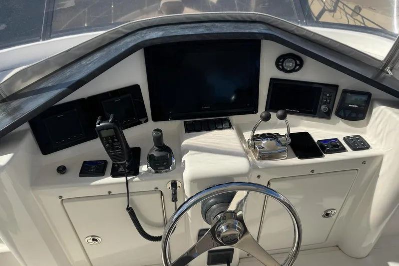My Reality Yacht Photos Pics Control panel of 2012 Neptunus 62 Flybridge yacht with navigation and communication equipment.