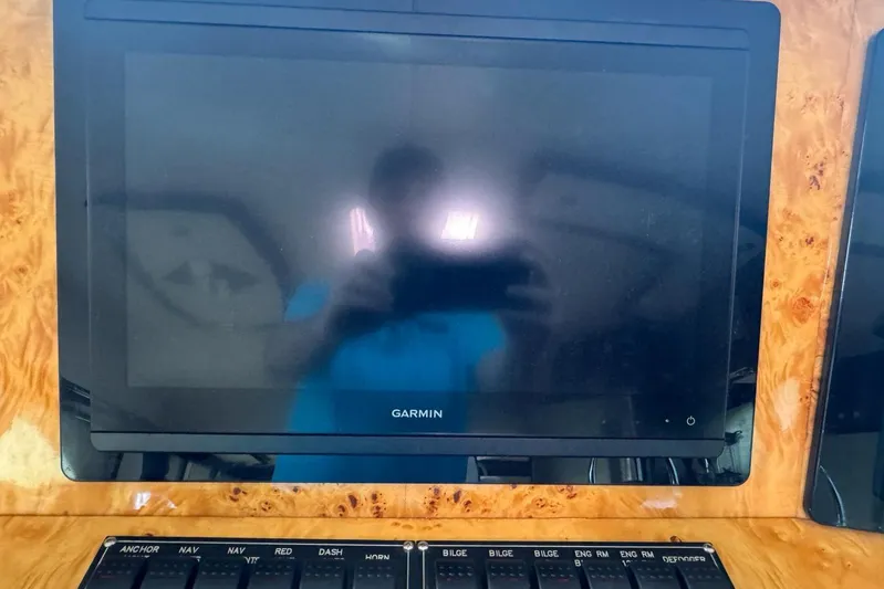 My Reality Yacht Photos Pics Garmin display on 2012 Neptunus 62 Flybridge yacht dashboard with control panel.