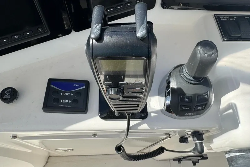 My Reality Yacht Photos Pics Control panel of a 2012 Neptunus 62 Flybridge yacht with joystick and radio.