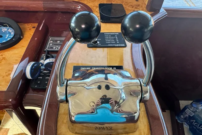 My Reality Yacht Photos Pics Control panel of 2012 Neptunus 62 Flybridge yacht with throttle levers and gauges.