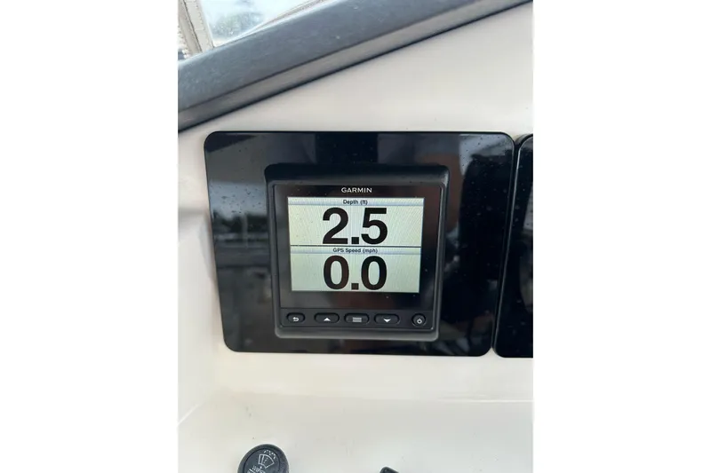 My Reality Yacht Photos Pics Garmin display on 2012 Neptunus 62 Flybridge showing depth and GPS speed.