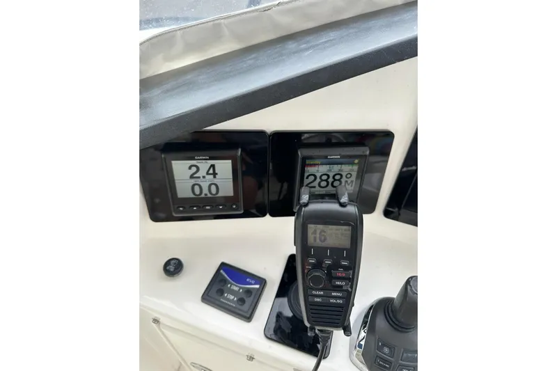 My Reality Yacht Photos Pics Control panel of 2012 Neptunus 62 Flybridge with Garmin displays and communication device.