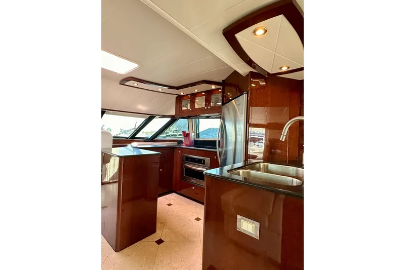 My Reality Yacht Photos Pics Luxurious kitchen interior of 2012 Neptunus 62 Flybridge yacht with modern appliances.