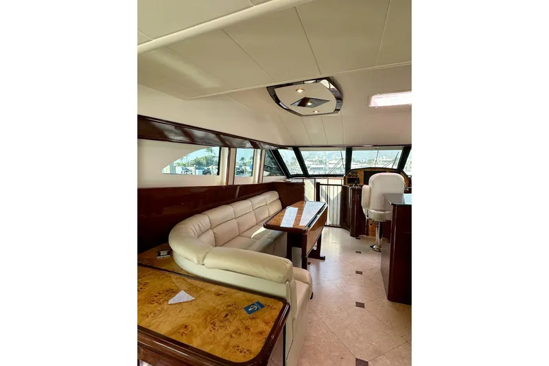 My Reality Yacht Photos Pics Luxurious interior of 2012 Neptunus 62 Flybridge yacht with elegant seating and helm.