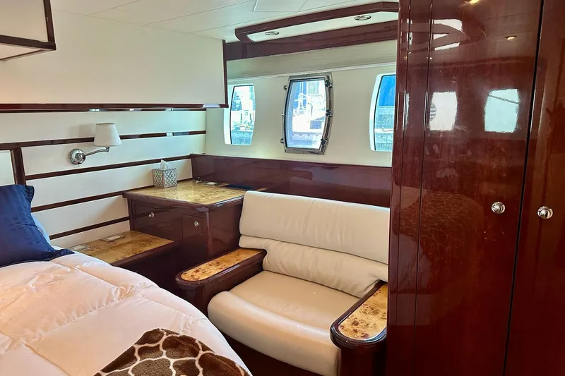 My Reality Yacht Photos Pics Luxurious cabin interior of 2012 Neptunus 62 Flybridge yacht with elegant wood finishes.