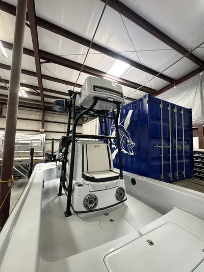  Yacht Photos Pics 2025 Yellowfin 24 CE boat in a warehouse, featuring advanced navigation equipment.