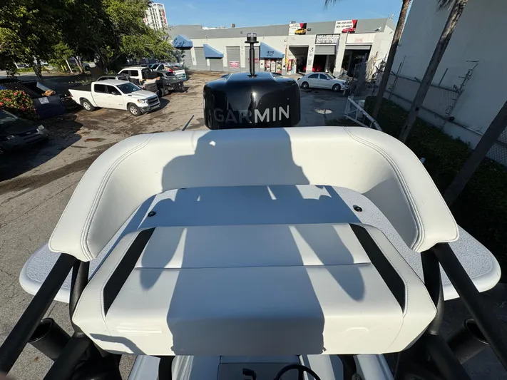  Yacht Photos Pics 2025 Yellowfin 24 CE boat with Garmin equipment, parked in an urban setting.