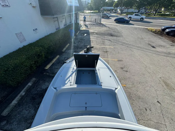  Yacht Photos Pics 2025 Yellowfin 24 CE boat parked in a lot, viewed from above.