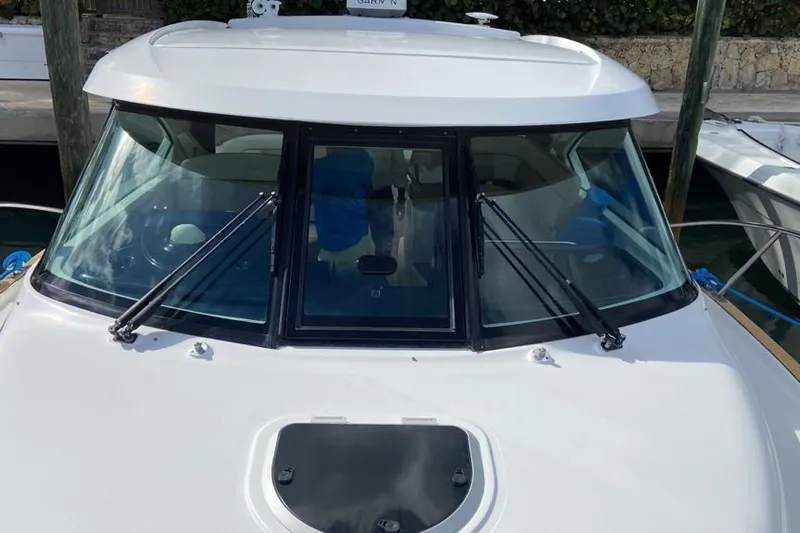  Yacht Photos Pics 2012 Tiara Yachts 3100 Coronet boat with windshield and wipers, docked at marina.