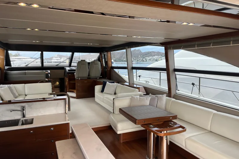  Yacht Photos Pics Luxurious interior of 2016 Princess 68 Flybridge Motor Yacht with elegant seating and panoramic windows.