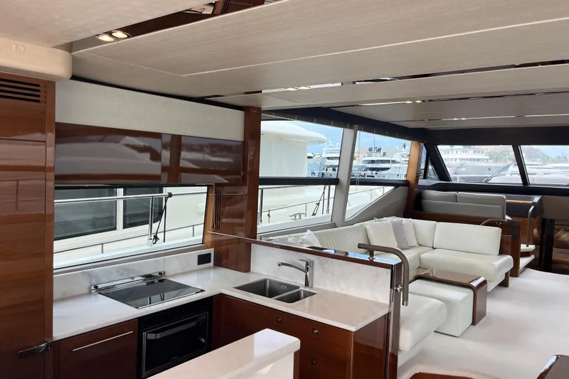  Yacht Photos Pics Luxurious interior of 2016 Princess 68 Flybridge Motor Yacht with modern kitchen and seating area.
