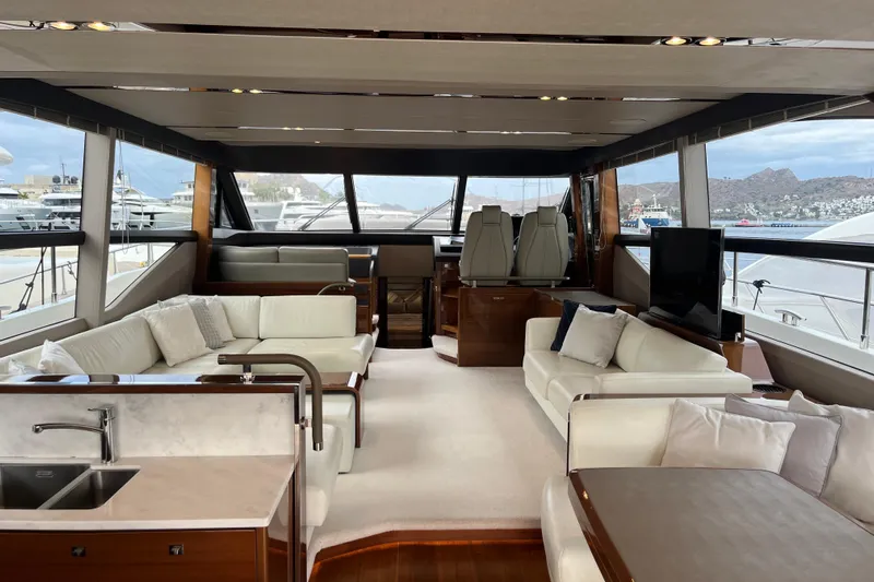  Yacht Photos Pics Luxurious interior of 2016 Princess 68 Flybridge Motor Yacht with elegant seating and panoramic windows.