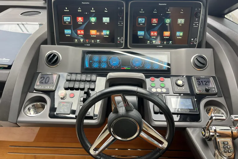  Yacht Photos Pics Control panel of a 2016 Princess 68 Flybridge Motor Yacht with advanced navigation displays.