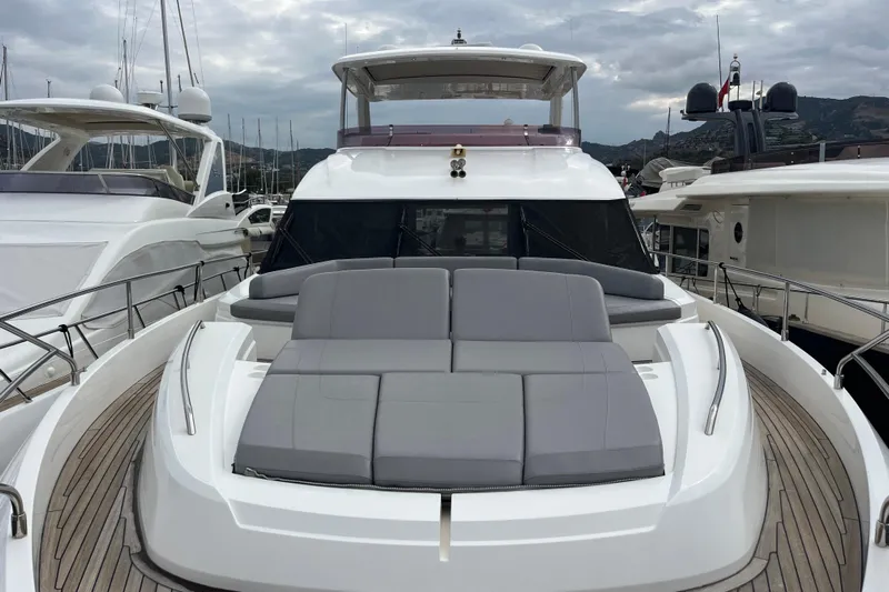  Yacht Photos Pics 2016 Princess 68 Flybridge Motor Yacht with sleek design and spacious deck in marina.