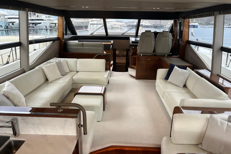  Yacht Photos Pics Luxurious interior of 2016 Princess 68 Flybridge Motor Yacht with elegant seating and panoramic windows.