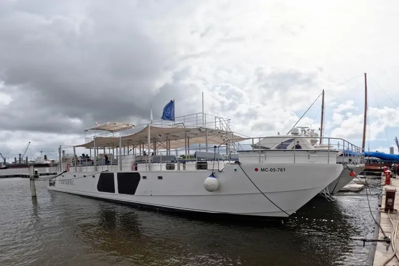  Yacht Photos Pics Custom PaxCat 80 boat docked at marina, 2024 model, under cloudy sky.