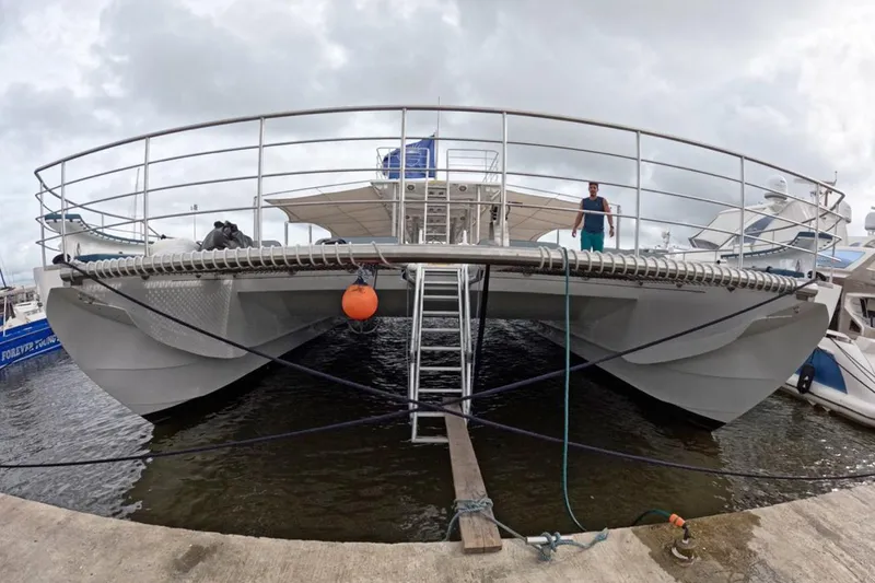  Yacht Photos Pics Custom PaxCat 80 catamaran docked, 2024 model, with overcast sky.