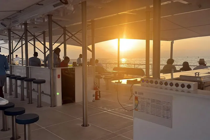  Yacht Photos Pics Sunset view from Custom PaxCat 80 yacht deck, 2024 model, with passengers enjoying the scenery.