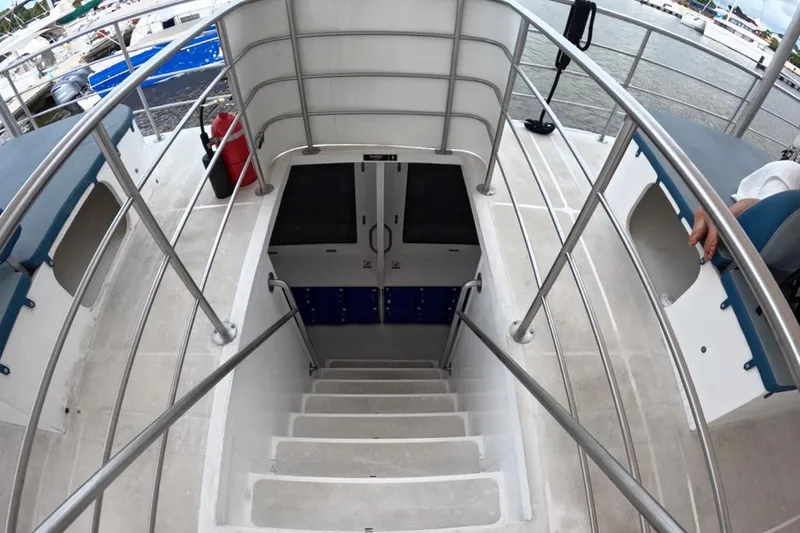  Yacht Photos Pics Staircase on 2024 Custom PaxCat 80 boat with railing and hatch door.