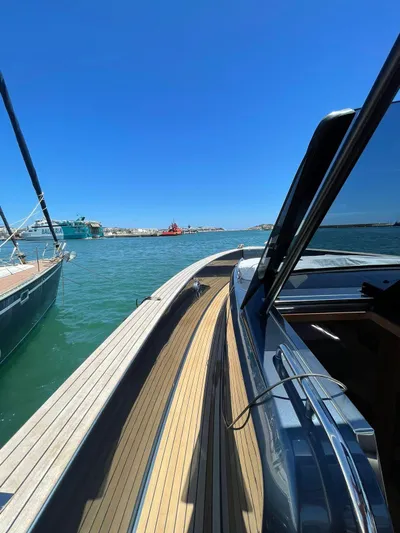  Yacht Photos Pics 2024 Pardo Yachts 43 on water, showcasing sleek design and wooden deck.