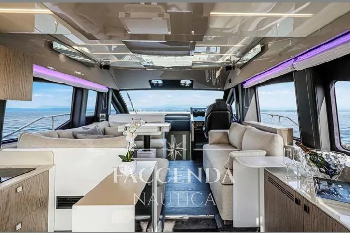  Yacht Photos Pics Luxurious interior of 2021 Cranchi E52S yacht with modern furnishings and panoramic windows.