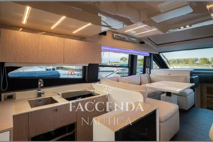  Yacht Photos Pics Luxurious interior of 2021 Cranchi E52S yacht with modern kitchen and seating area.