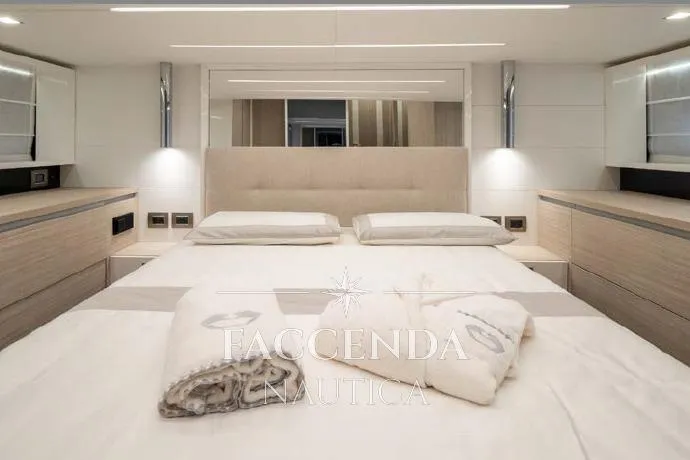  Yacht Photos Pics Luxurious bedroom interior of 2021 Cranchi E52S yacht with modern design and elegant furnishings.
