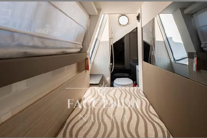  Yacht Photos Pics Interior of 2021 Cranchi E52S yacht, featuring modern design and compact bathroom.