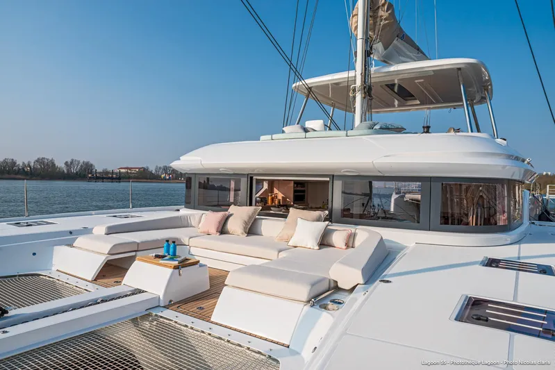  Yacht Photos Pics Luxurious 2024 Lagoon 55 yacht with spacious deck and comfortable seating.