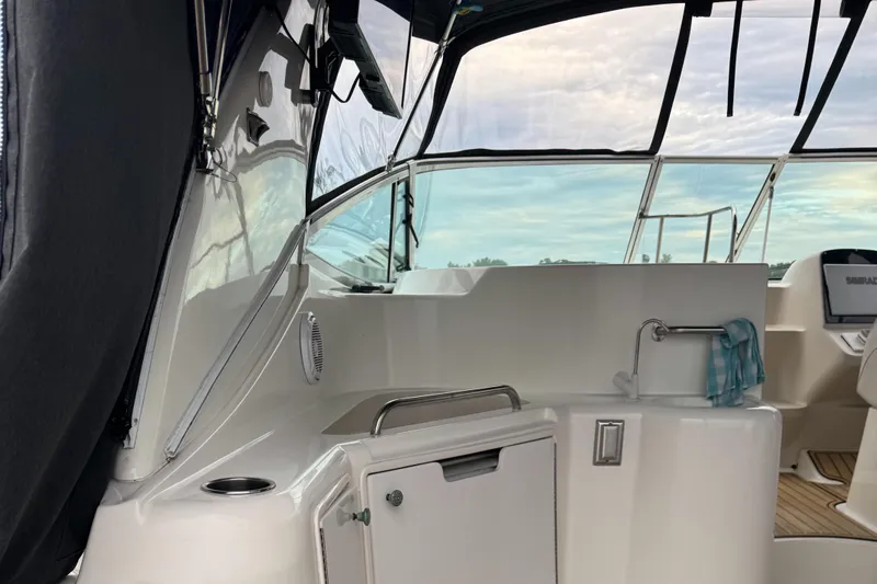  Yacht Photos Pics 2000 Cruisers Yachts 3870 Express cockpit with sink and seating area.