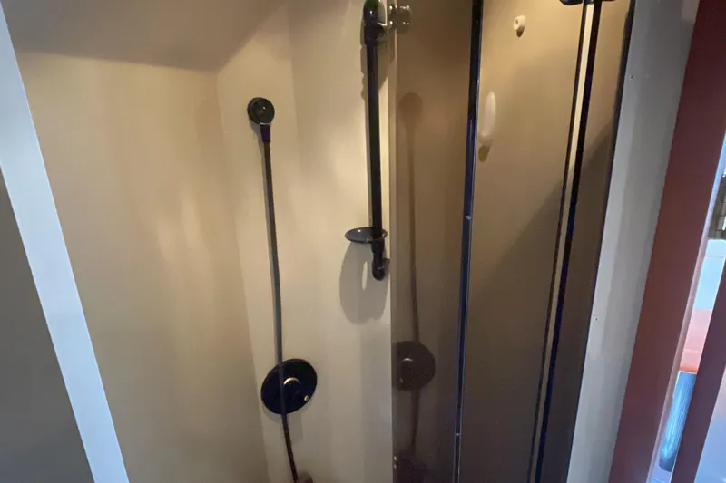  Yacht Photos Pics Shower area inside 2000 Cruisers Yachts 3870 Express, featuring modern fixtures and sleek design.