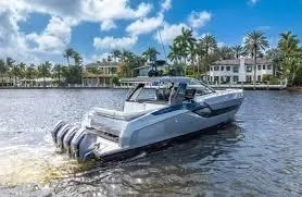 47 Verve Yacht Photos Pics 2021 Azimut Verve 47 yacht cruising on a sunny day near waterfront homes.