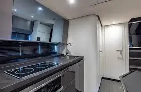 47 Verve Yacht Photos Pics Modern kitchen interior of 2021 Azimut Verve 47 yacht, featuring sleek design and appliances.