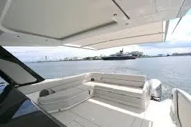 47 Verve Yacht Photos Pics 2021 Azimut Verve 47 yacht deck with seating, overlooking calm waters.