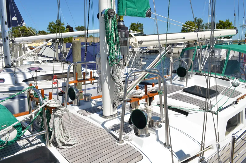 Fleur De Lys Yacht Photos Pics Sailboat deck of 1986 Hans Christian Christina, featuring ropes and equipment in a marina setting.