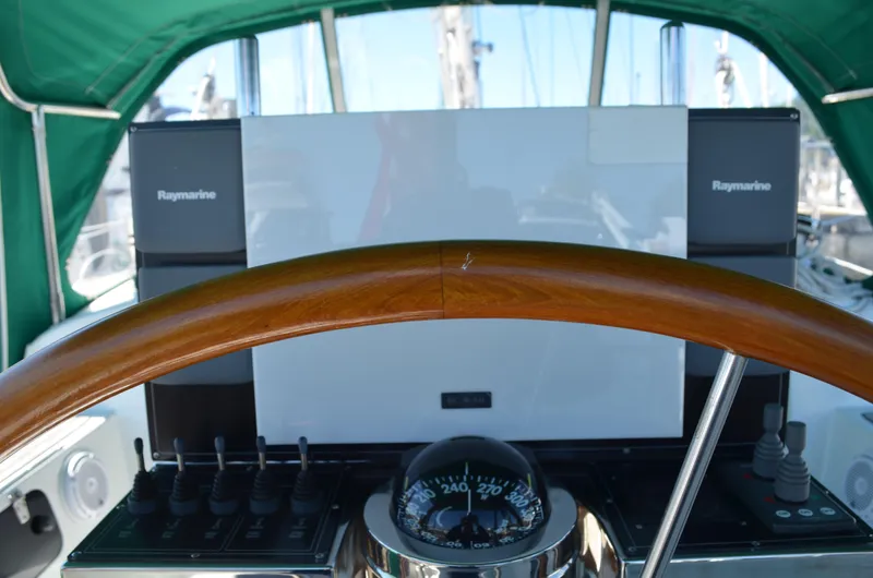 Fleur De Lys Yacht Photos Pics Steering wheel and navigation equipment on a 1986 Hans Christian Christina sailboat.
