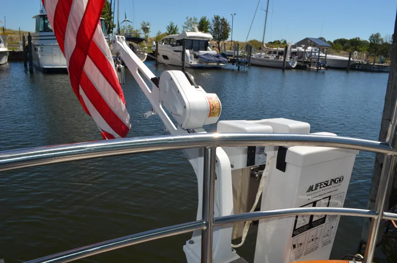 Fleur De Lys Yacht Photos Pics Sailboat deck with lifesaving equipment and American flag, Hans Christian Christina 1986 model.