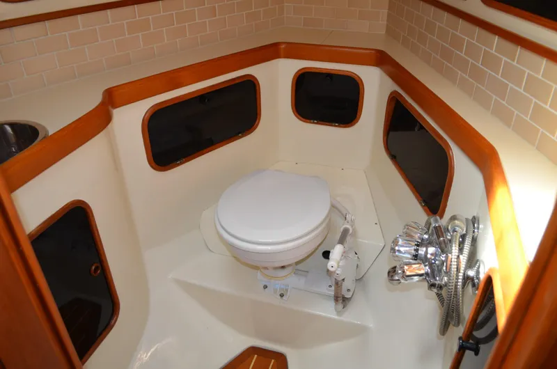 Fleur De Lys Yacht Photos Pics 1986 Hans Christian Christina boat bathroom with toilet and wooden trim.