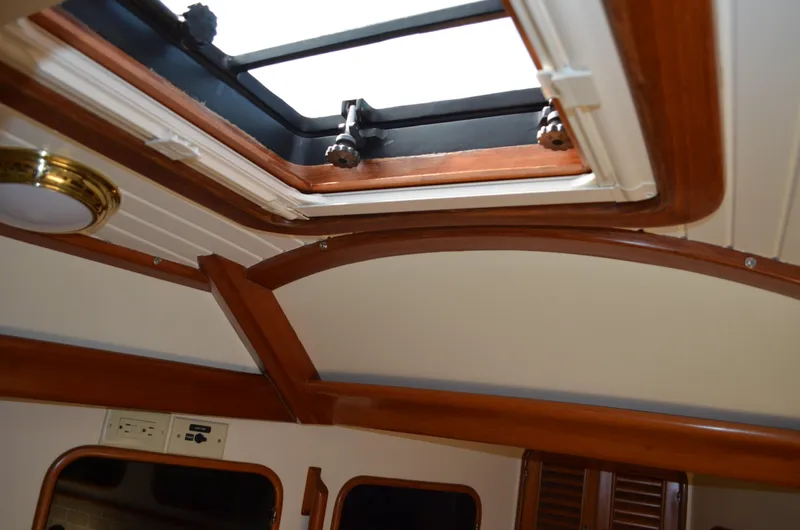 Fleur De Lys Yacht Photos Pics Interior view of 1986 Hans Christian Christina yacht with wooden trim and skylight.